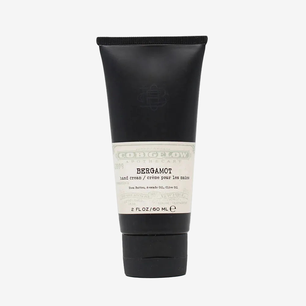 Black tube of bergamot hand cream with white label on a white background